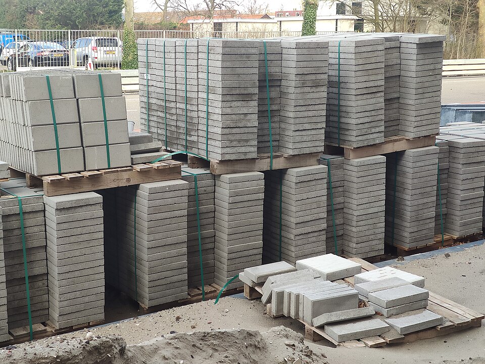 Badly cropped photo of pallets of paving slabs